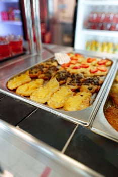 Bustling Cafeteria Serving Line During Lunchtime Offering a Variety of Dishes photo