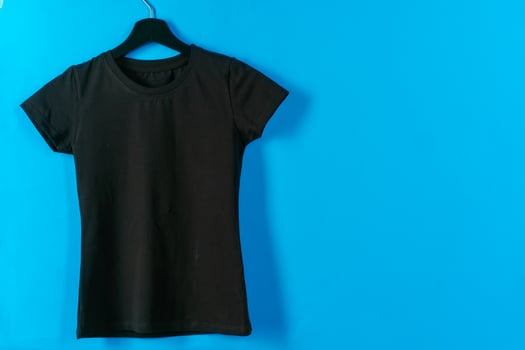 Black plain t-shirt hanging on a hanger photo