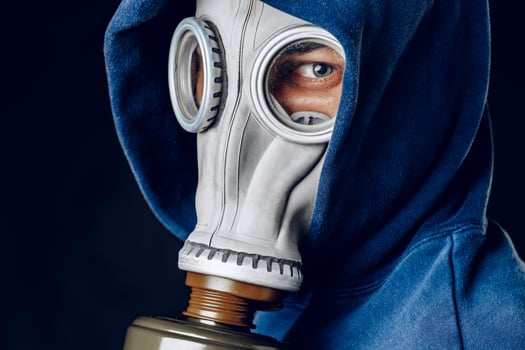 Portrait of a man in a gas mask. Panic during quarantine. Coronavirus pandemia photo