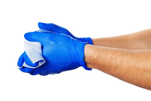 Hand with blue gloves takes a white cloth photo