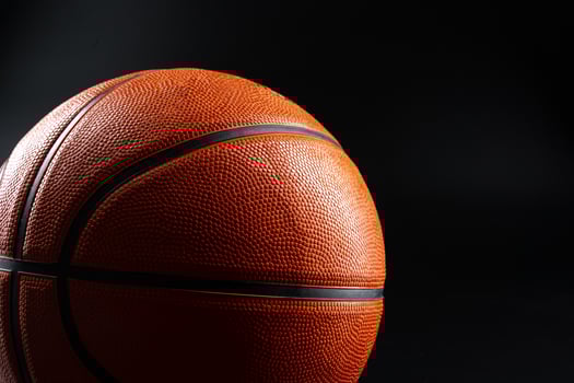Basketball ball close up on dark black background photo