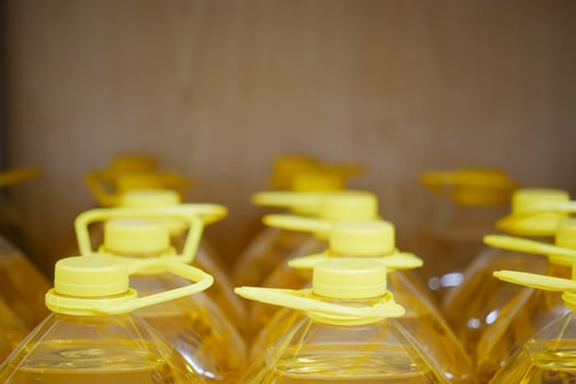 yellow sunflower oil bottle lined up in a store photo