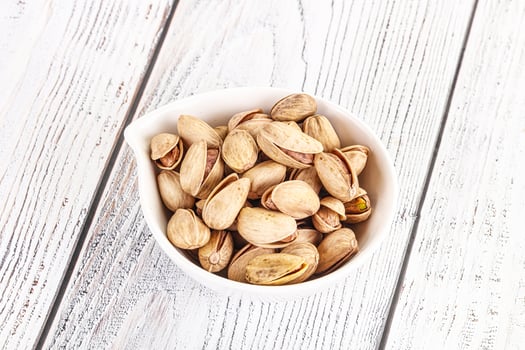 Salted tasty pistachio nuts heap photo