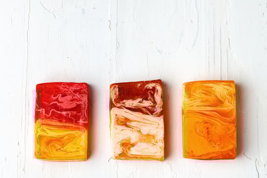 Bar of natural handmade soap on white wooden background. photo