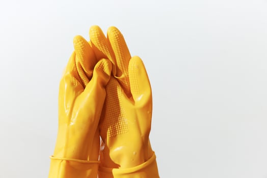 Yellow rubber gloves isolated on white background. pair of cleaning gloves with copy space for text photo