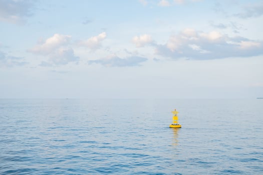 Yellow Buoy in Calm Sea photo