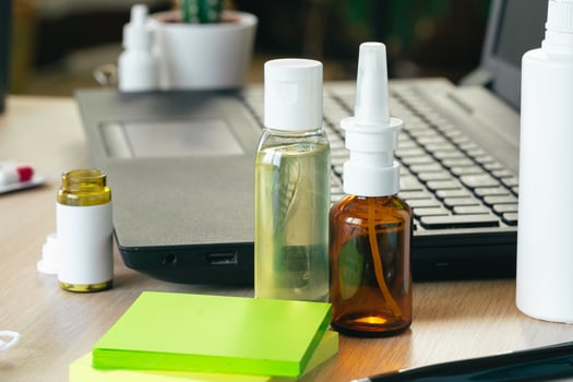 Medicine bottle on an office table with laptop photo