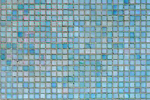 Wall of small blue tiles. Abstract design background. photo