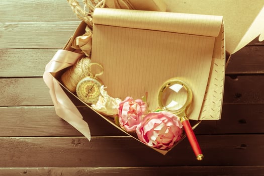 flowers and a notebook on wooden background photo