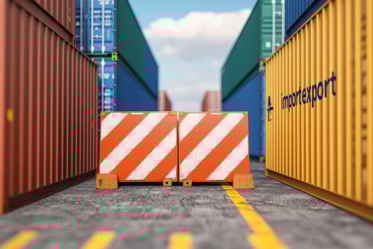 Traffic barrier blocking path among shipping containers in a port. photo