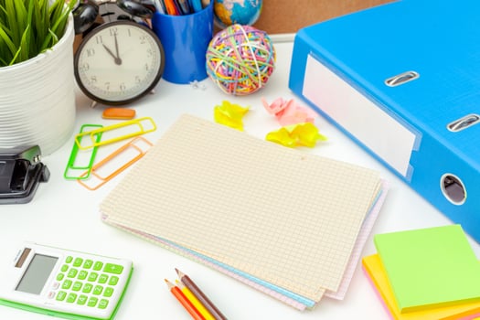 Work place of a creative person with a variety of colorful stationery objects photo