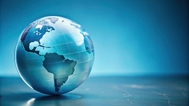 3D rendering of a light blue globe on a solid blue background photo