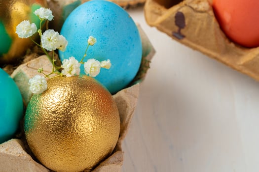 Many Easter eggs decorated with floral branches photo