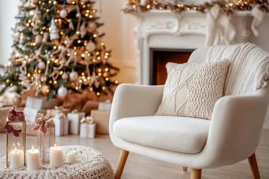 Living room with a Christmas tree, soft armchair, candles, and festive holiday decor photo