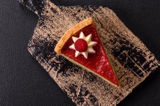 Delicious sweet dessert cheesecake with raspberry and pistachio flavor photo
