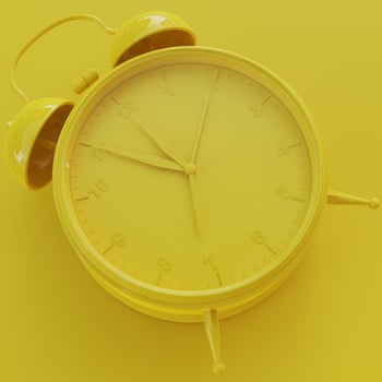 Yellow Analog Clock with Yellow Background photo