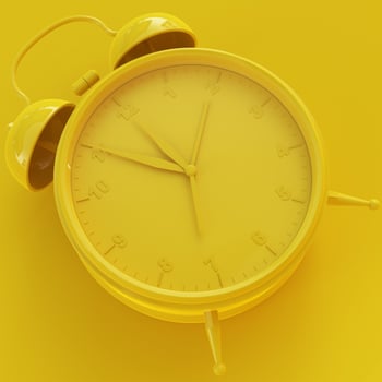 Yellow Analog Clock with Yellow Background photo
