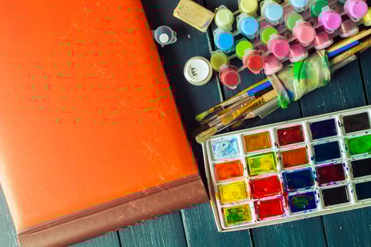 Set of watercolor paints and paintbrushes for painting photo