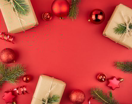 Christmas frame with gift boxes on a red background. Christmas background. Layout of a banner, postcard. The apartment was lying. Copy space photo
