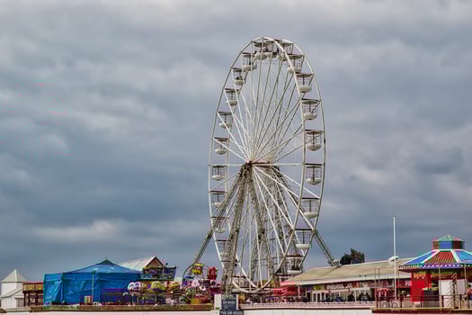 Ferris Wheel at Amusement Park Under Cloudy Sky in Blackpool, UK photo