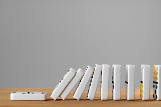 White domino dice on a wooden table photo