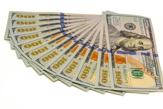fanned out group of one hundred dollar bills isolated on a white background photo