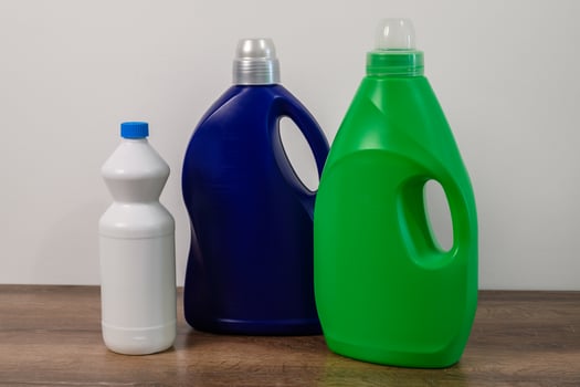 multicolored bottles with household chemicals photo
