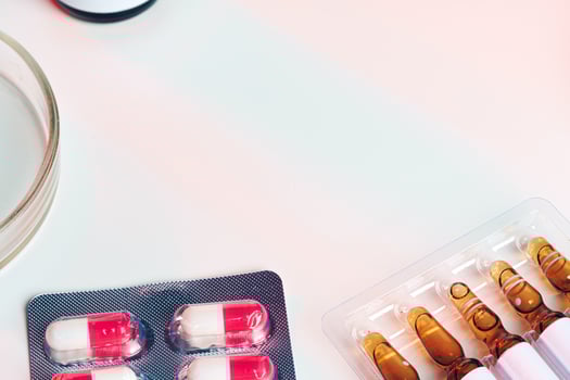 Medicine pills on white table for medical concept photo