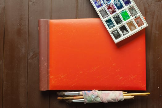 Set of watercolor paints and paintbrushes for painting photo