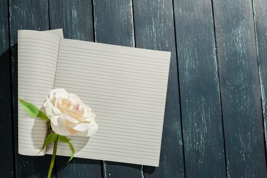 flowers with empty vintage notebook for your design photo