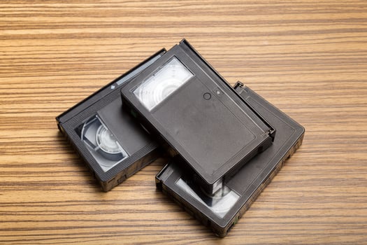 tape cassette over wooden background photo