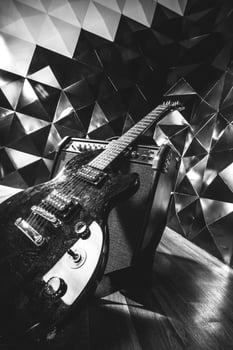 electric guitar and classic amplifier on a dark background photo