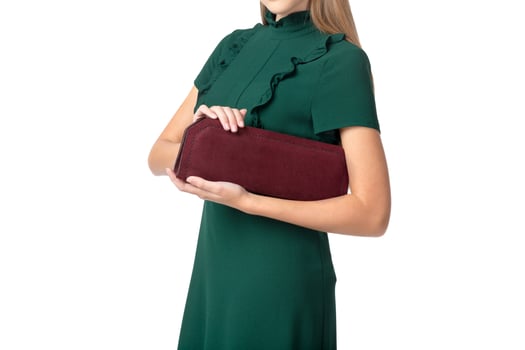 Woman holding a handbag isolated on white background photo