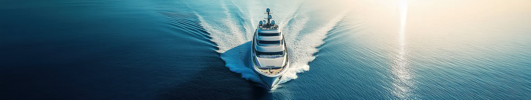 Luxurious yacht cruising through serene waters at sunset photo