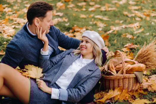Happy couple enjoying golden autumn spring season in the park photo