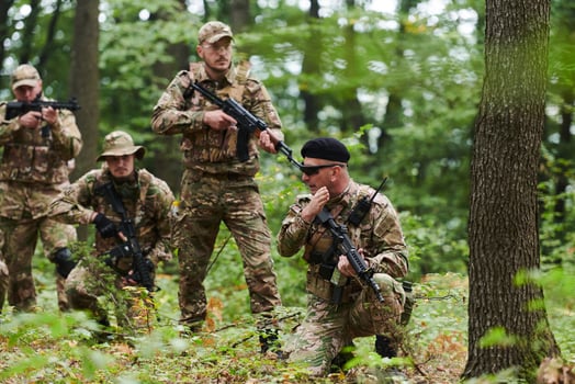 A disciplined and specialized military unit, donned in camouflage, strategically patrolling and maintaining control in a high-stakes environment, showcasing their precision, unity, and readiness for photo