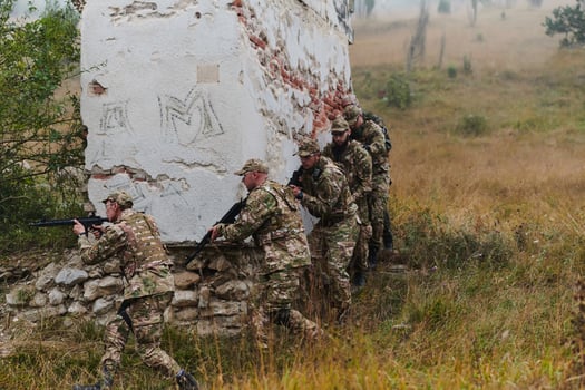 In a high stakes mission, a specialized military unit executes a tactical operation to secure a dangerous house where terrorists are believed to be hiding, showcasing precision and coordinated photo