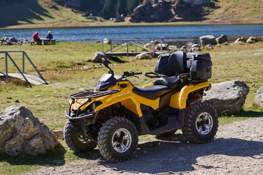 Yellow modern quad in nature ready for driving photo