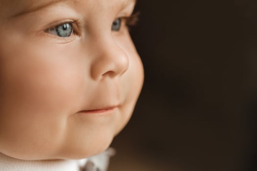 Close-up of a cheerful little boy in the background photo