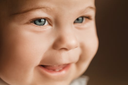 Close-up of a cheerful little boy in the background photo
