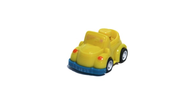 Plastic children's toys on a white background. small white car. Plastic children's toys. Children's toy. photo