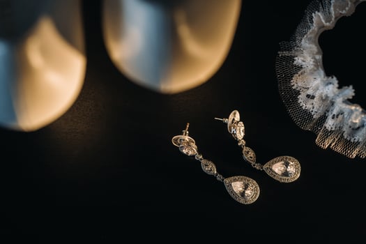Accessories for the bride. Wedding Earrings on a black background. photo
