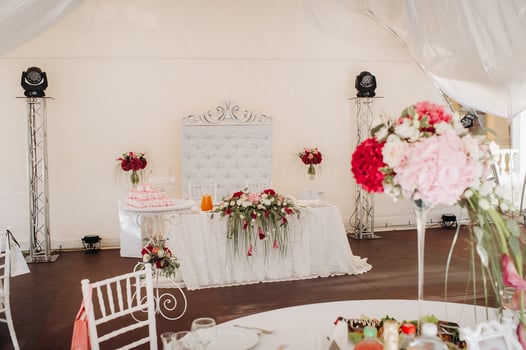 wedding table decoration with flowers on the table in the castle, table decor for dinner by candlelight.Dinner with candles photo