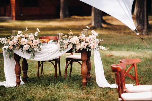 wedding table decoration with flowers on the table in the castle, table decor for dinner by candlelight.Dinner with candles photo