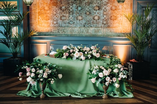 wedding table decoration with flowers on the table in the castle, table decor for dinner by candlelight.Dinner with candles photo