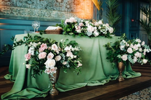 wedding table decoration with flowers on the table in the castle, table decor for dinner by candlelight.Dinner with candles photo