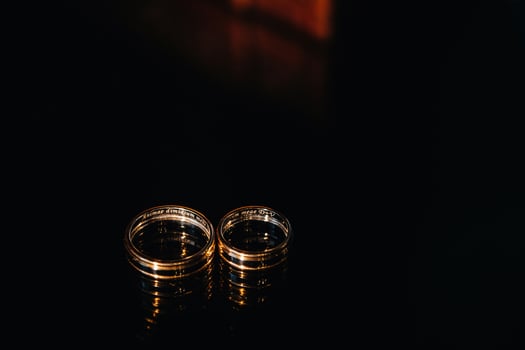Close-up of two gold wedding rings for a wedding photo