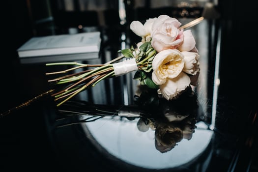 wedding bouquet with roses and boutonniere.The decor at the wedding photo