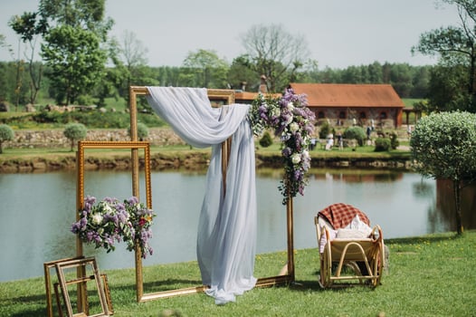 Photo zone at a wedding near the lake with a chair.summer wedding Decoration for guests
