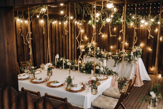 wedding table decoration with flowers on the table in the castle, table decor for dinner by candlelight.Dinner with candles photo